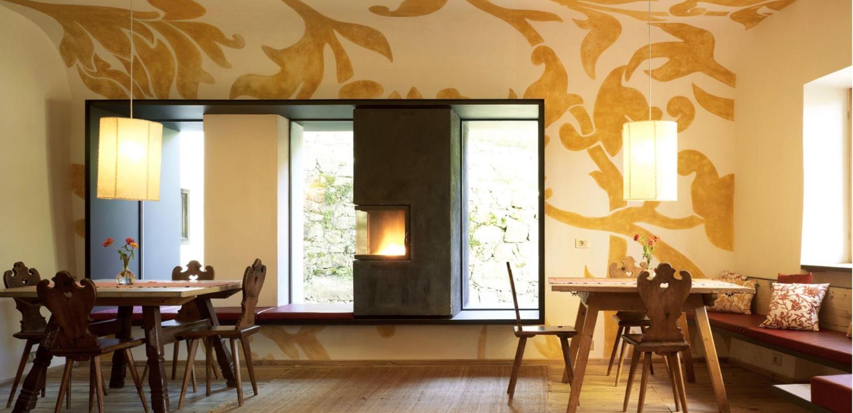 Our music room with tables and a fireplace